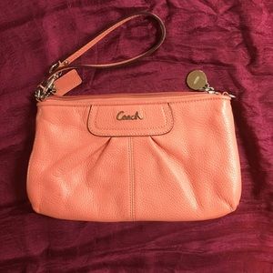 Coach coral leather wristlet